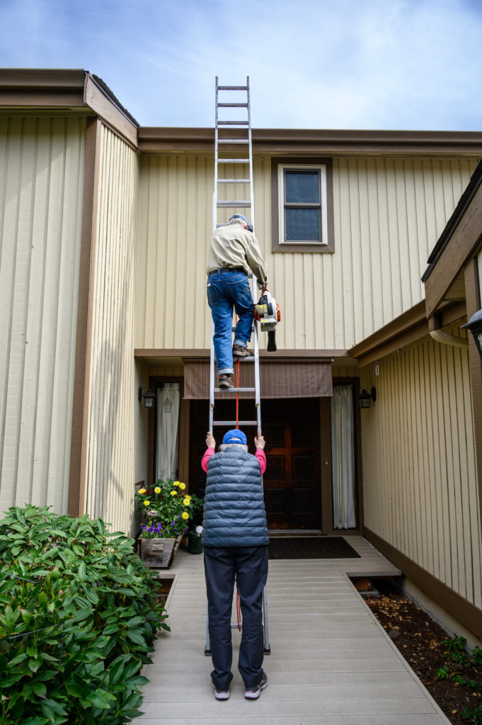 climbing a ladder and protecting your head